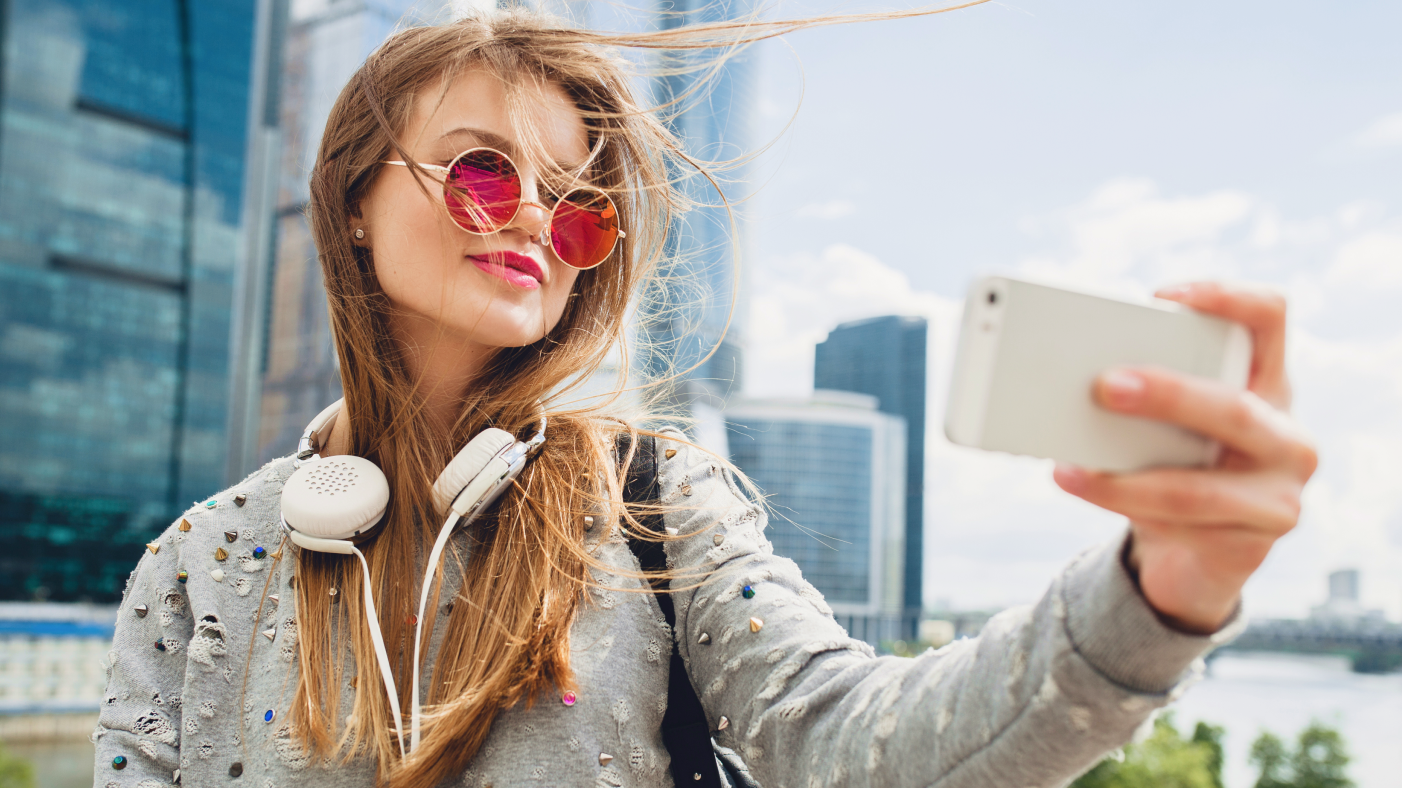 Girl in sunglasses taking a selfie